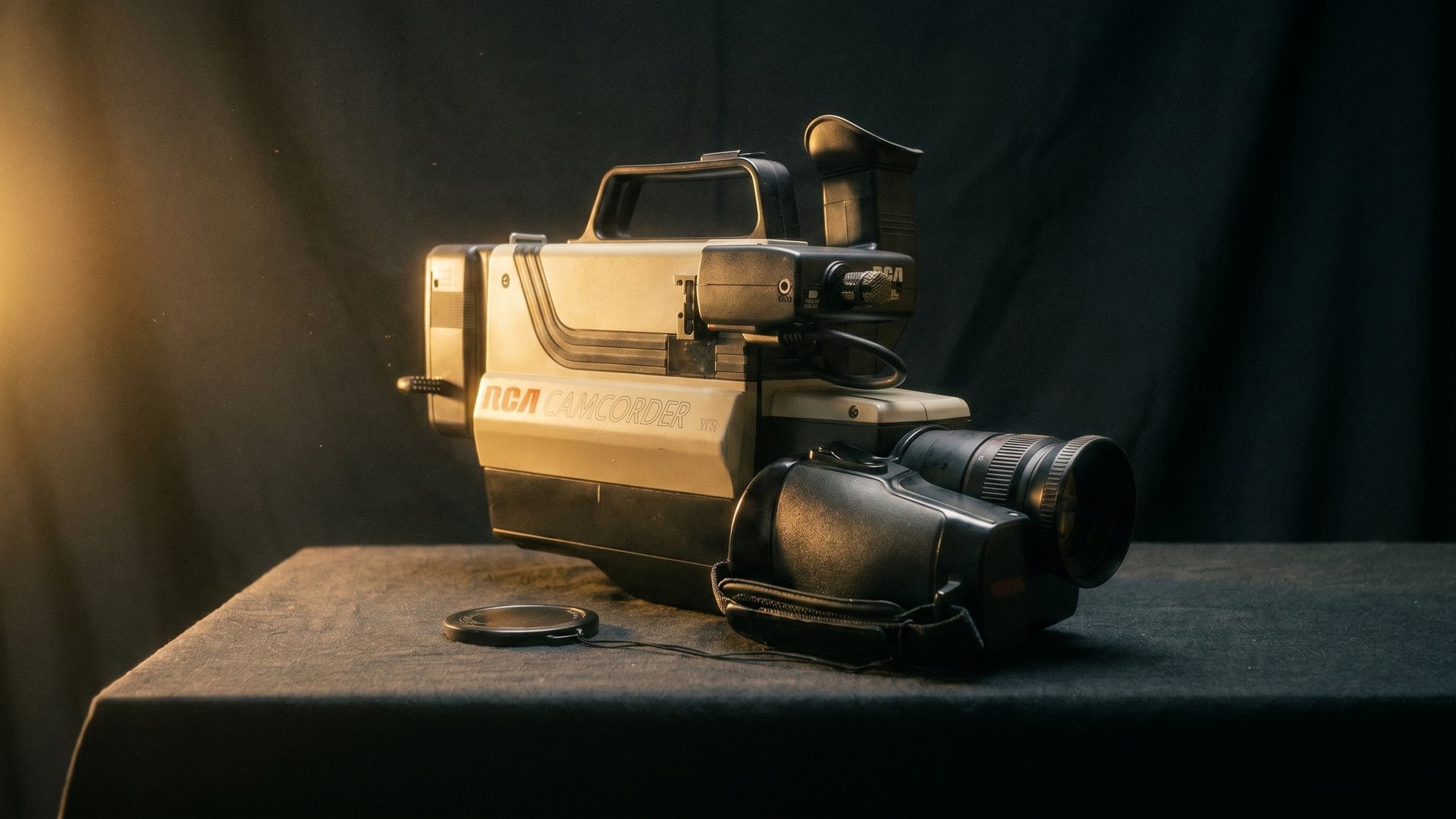 A vintage VHS camcorder in moody light
