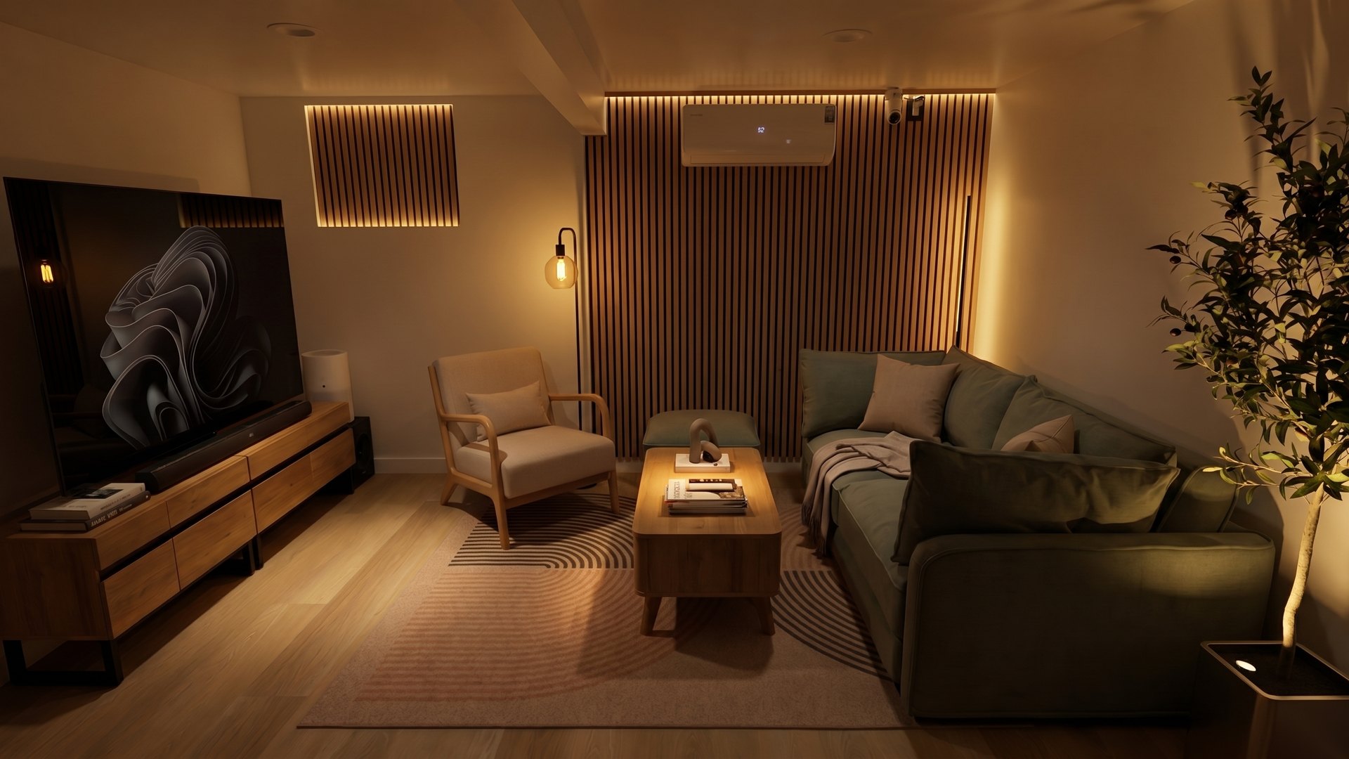The studio lounge with a sofa and big screen